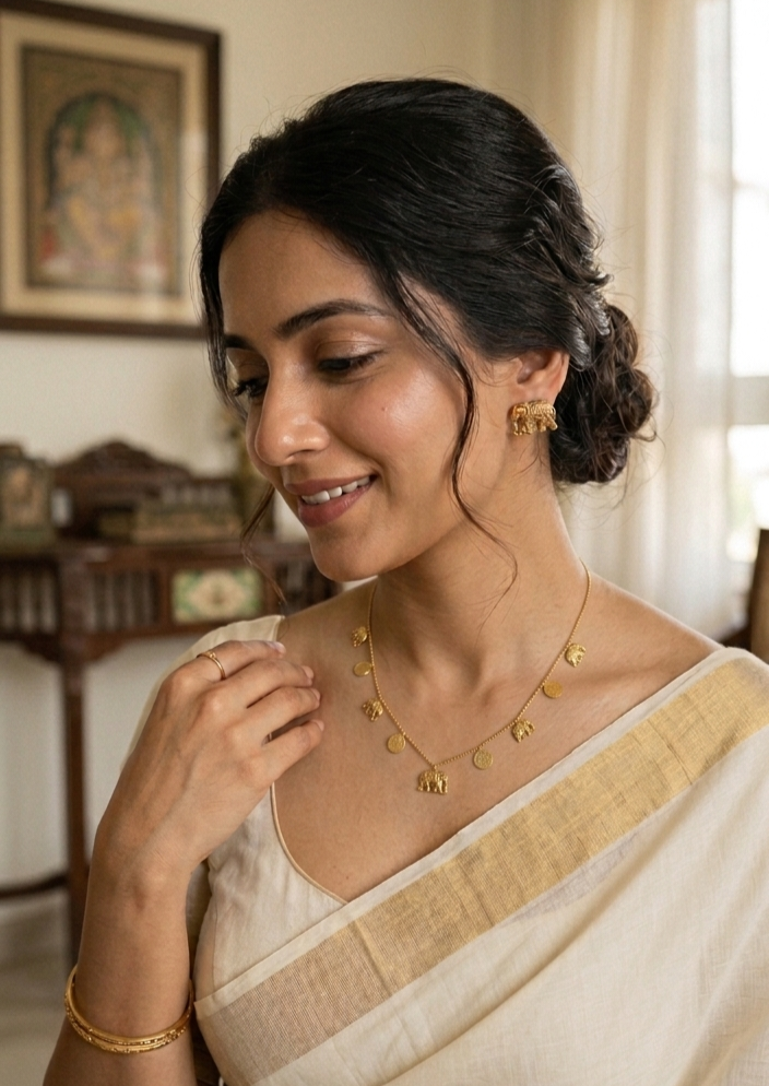 Product Title: "Divine Heritage" Artisan Gold Elephant Charm Necklace and Earring Set